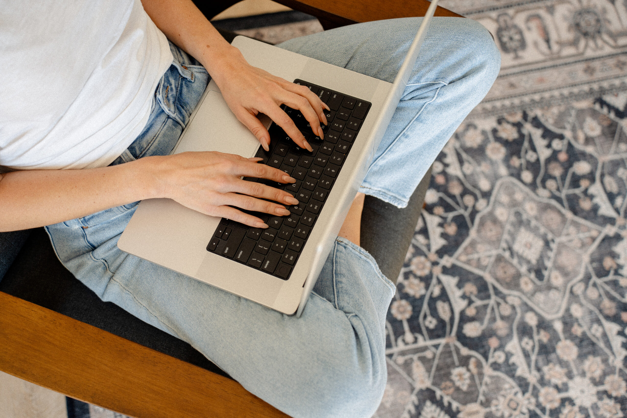 sitting down with a laptop